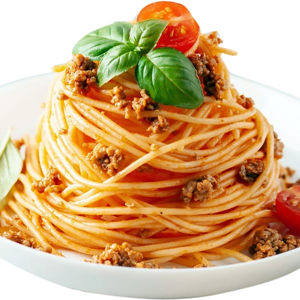 Spaghetti bolognese with ground meat, basil, and cherry tomatoes on a white plate.